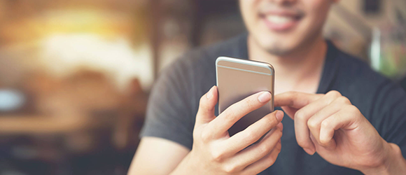 Man working on mobile phone.